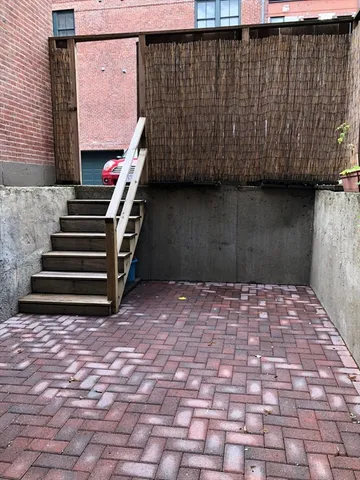 a backyard of a house with barbeque oven