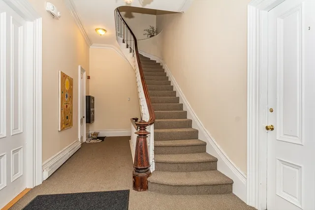 a view of entryway with wooden floor