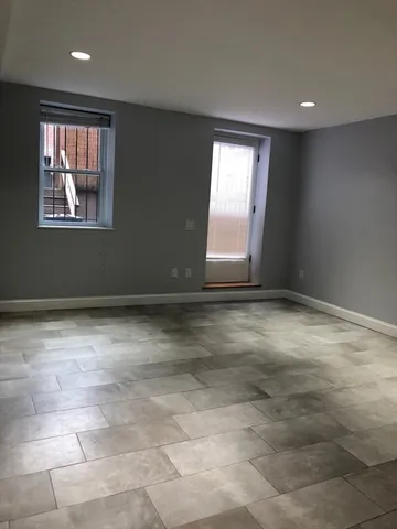 a view of an empty room with a window