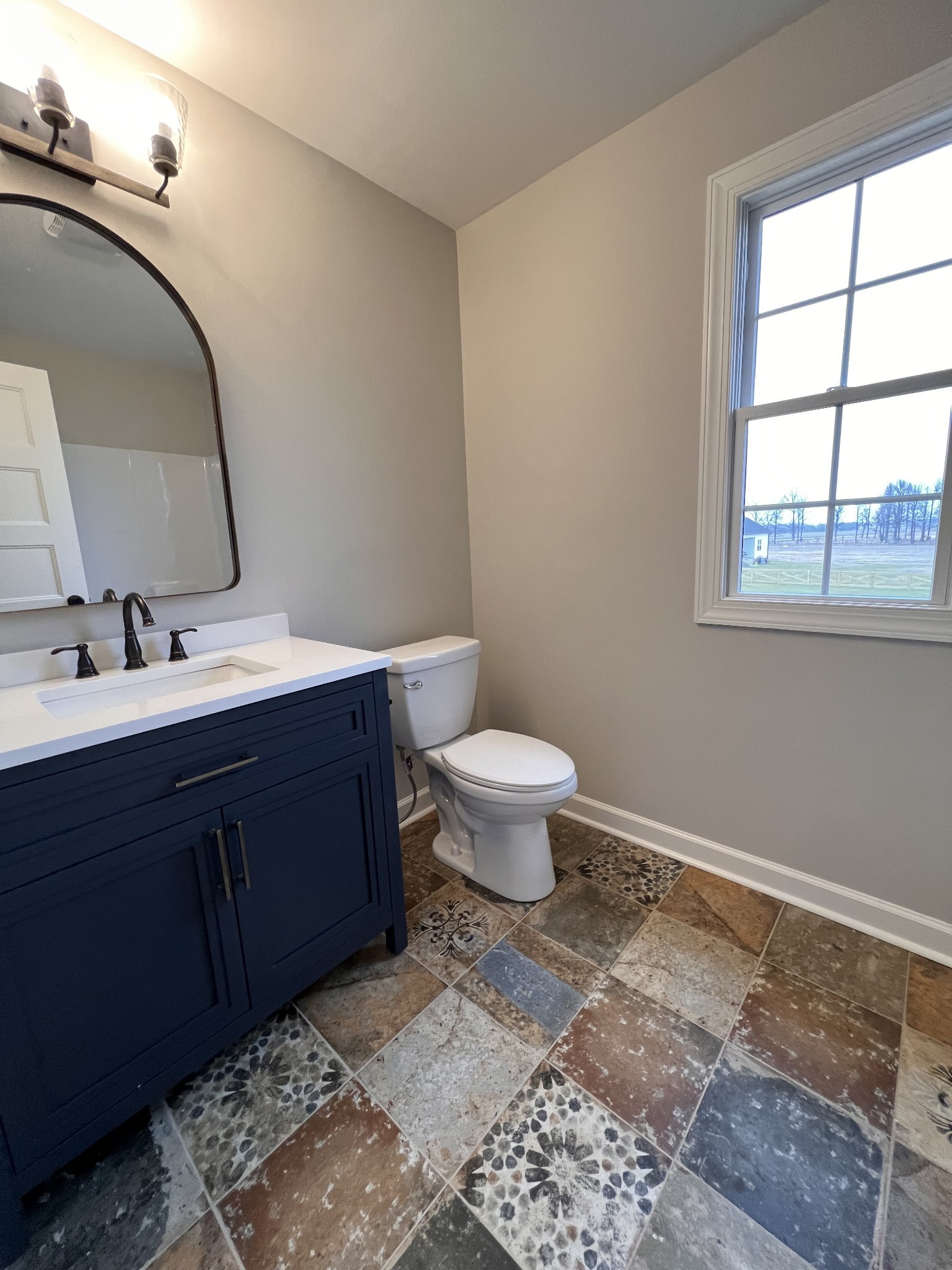 739 Jackson Road, Unit 1 Portland, TN 37148 - Photo 16 of 21 a bathroom with a toilet sink and mirror