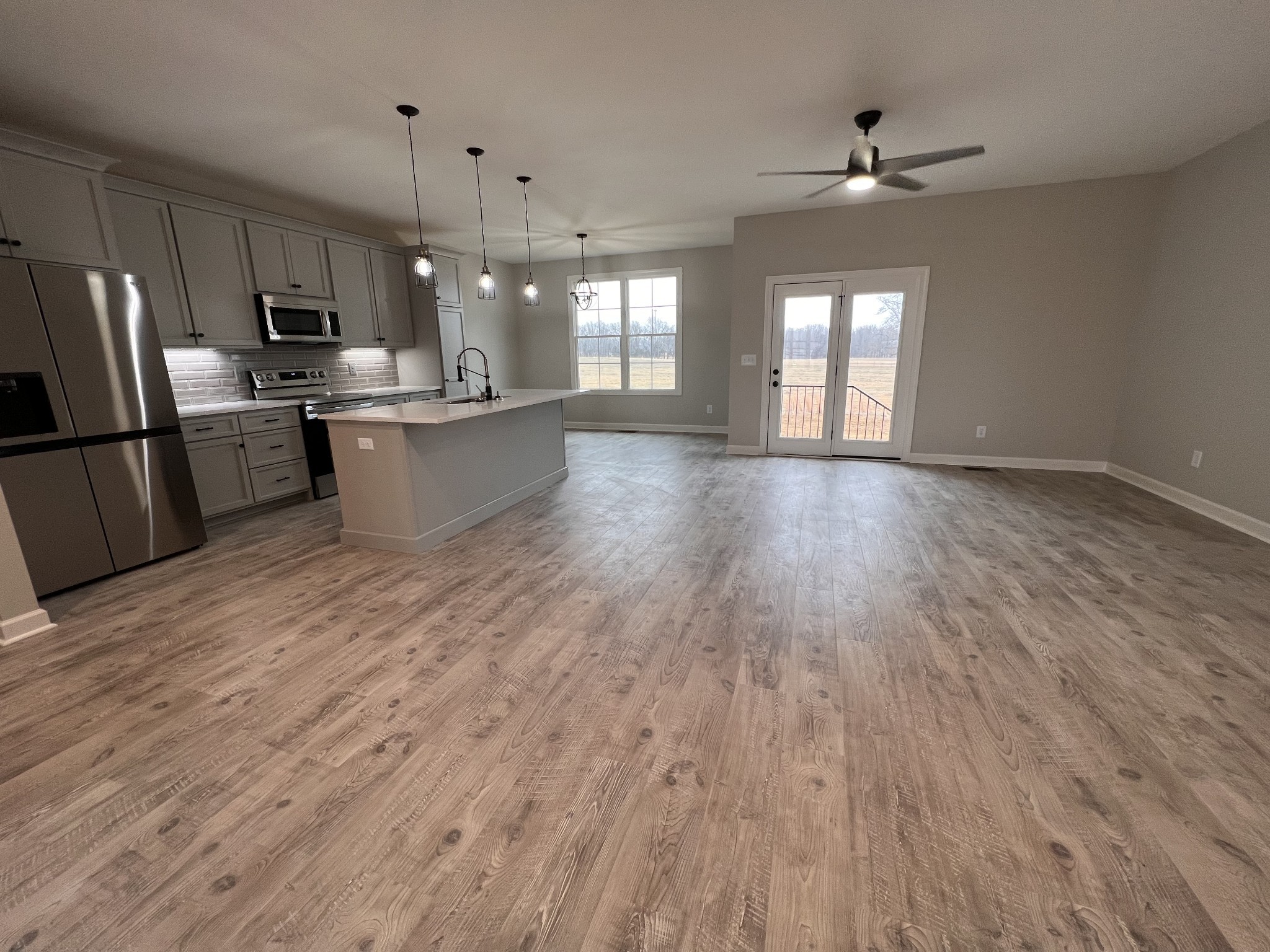 739 Jackson Road, Unit 1 Portland, TN 37148 - Photo 4 of 21 a view of kitchen with sink microwave refrigerator and cabinets