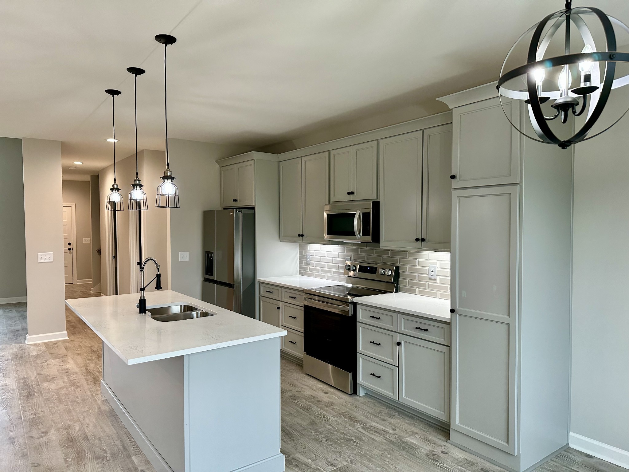 739 Jackson Road, Unit 1 Portland, TN 37148 - Photo 7 of 21 a kitchen with stainless steel appliances kitchen island a refrigerator sink and cabinets