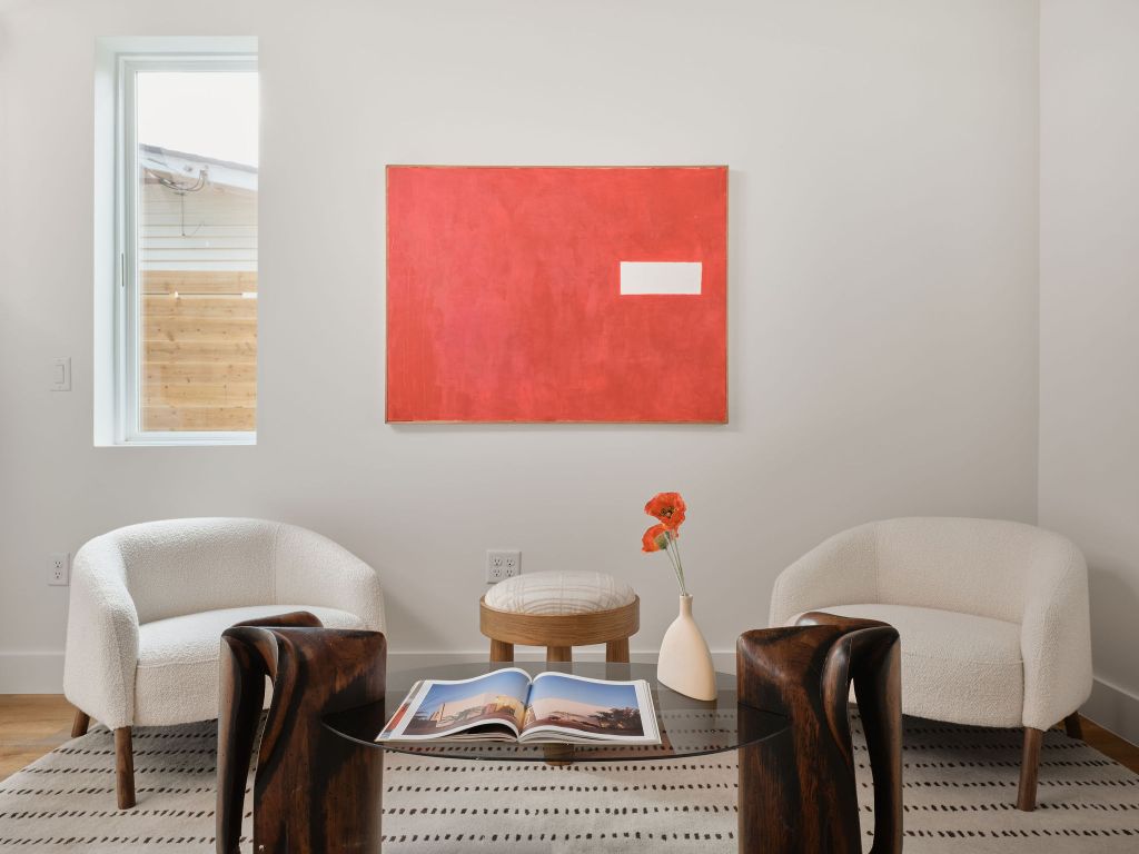 3307 Kay Street, Unit 1 Austin, TX 78702 - Photo 13 of 40 a living room with furniture a window and a lamp
