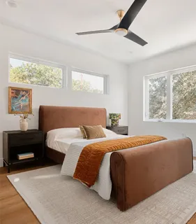 a bedroom with bed and window