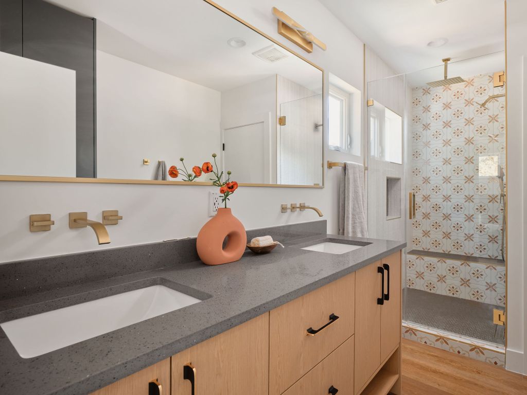 3307 Kay Street, Unit 1 Austin, TX 78702 - Photo 22 of 40 a bathroom with a sink and a mirror