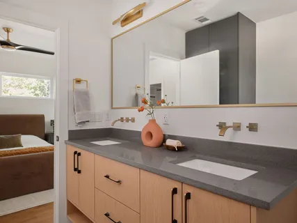 a bathroom with a shower and a sink