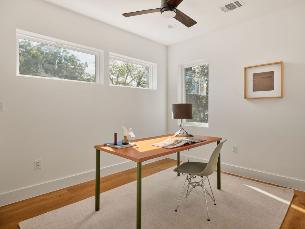 3307 Kay Street, Unit 1 Austin, TX 78702 - Photo 26 of 40 a view of a workspace with furniture and a window