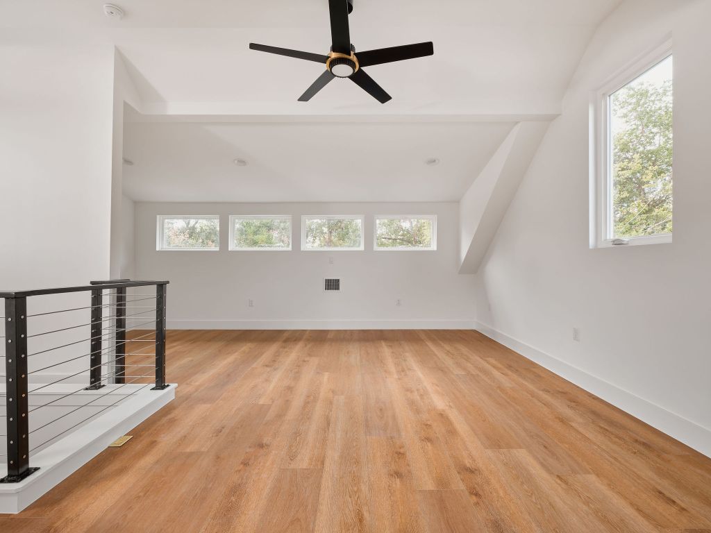 3307 Kay Street, Unit 1 Austin, TX 78702 - Photo 30 of 40 wooden floor in an empty room with a window