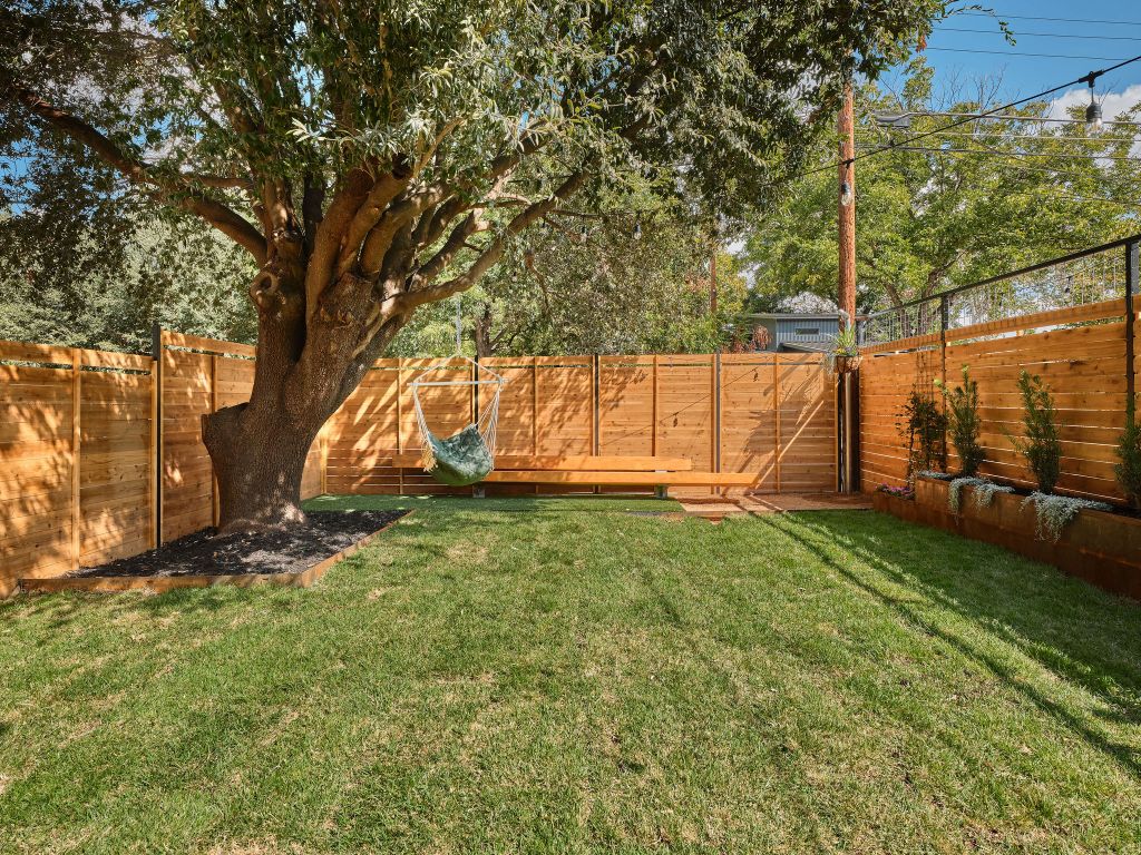 3307 Kay Street, Unit 1 Austin, TX 78702 - Photo 33 of 40 a view of backyard with tub and trees