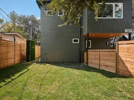a view of backyard with tub and trees