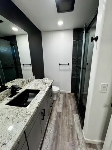 a kitchen with a sink and a refrigerator