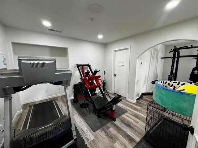 a room with furniture and a wooden floor