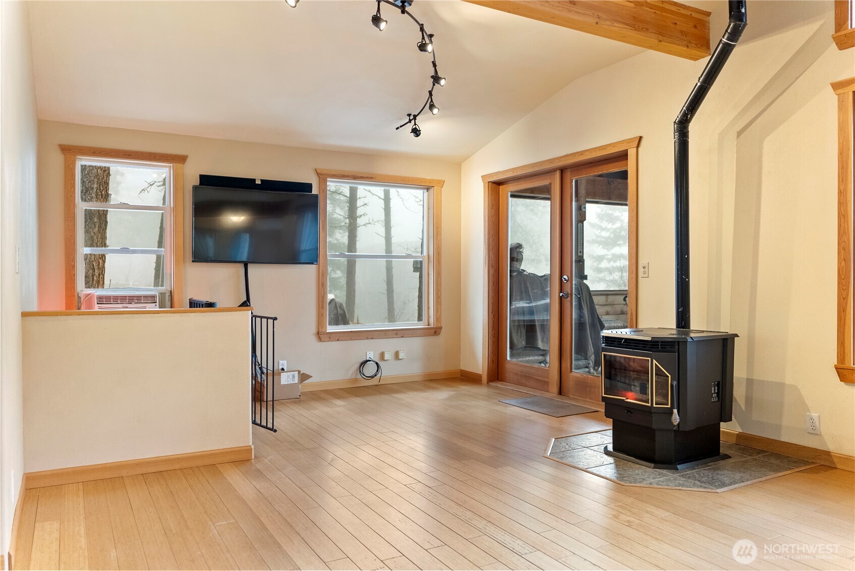 80 Homestead Road Winthrop, WA 98862 - Photo 13 of 40 a living room with furniture and a flat screen tv