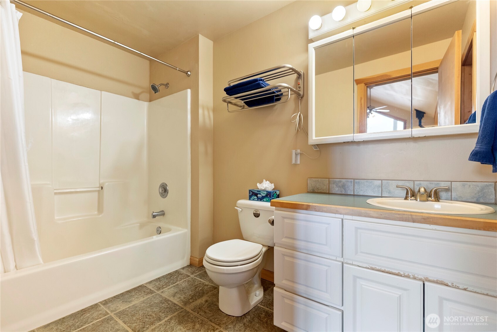 80 Homestead Road Winthrop, WA 98862 - Photo 24 of 40 a bathroom with a granite countertop bathtub sink vanity mirror and toilet