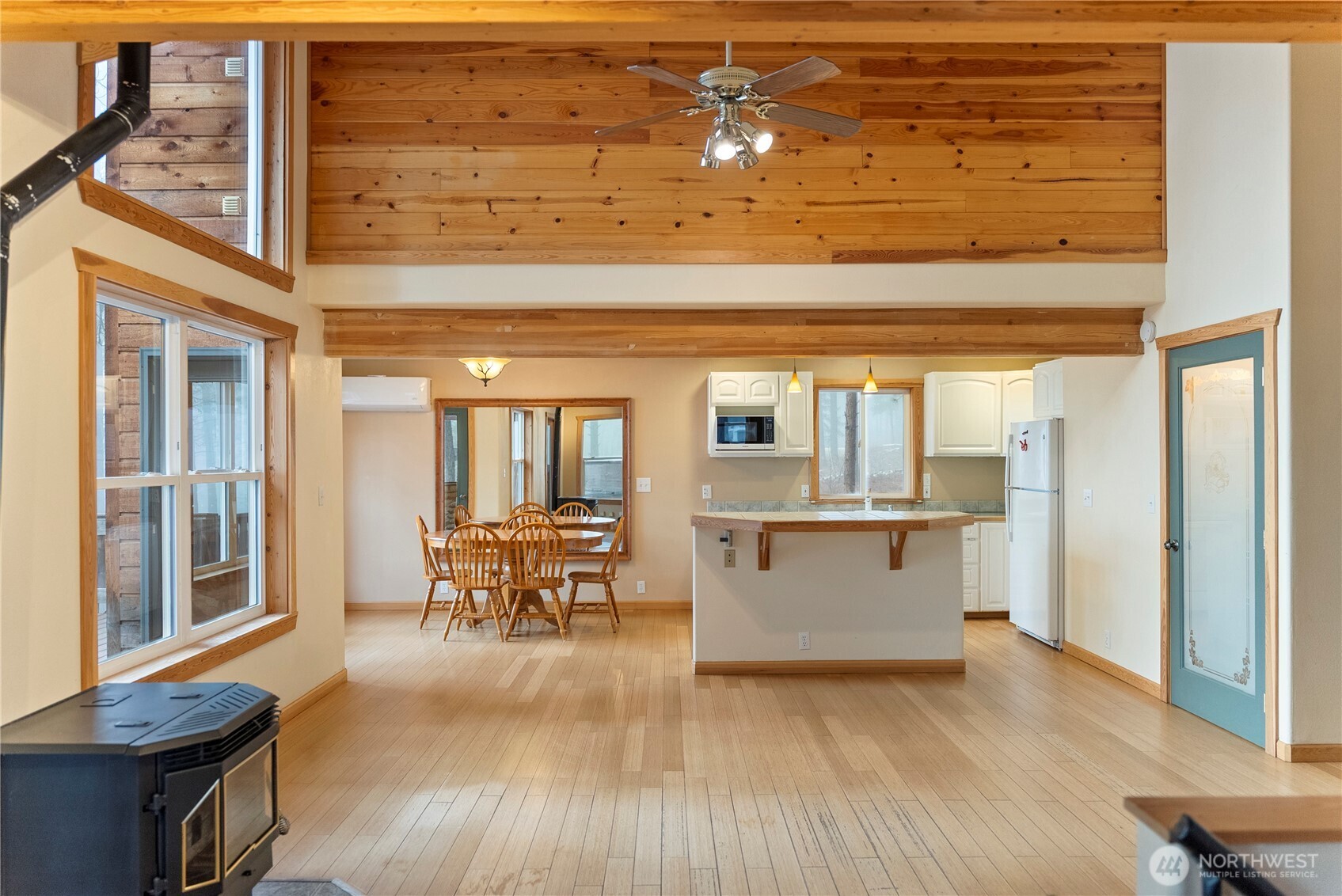 80 Homestead Road Winthrop, WA 98862 - Photo 9 of 40 a view of a large dining room with wooden floor and a large window