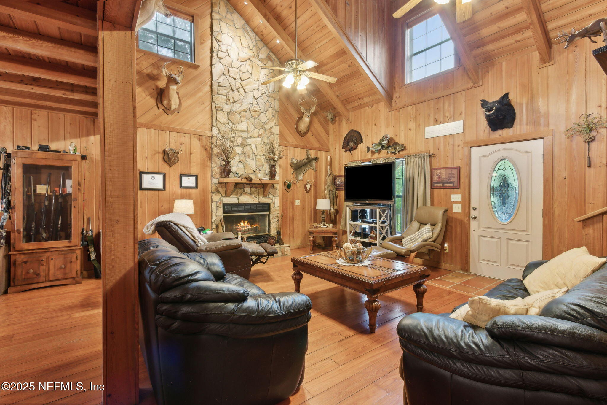 37334 Alice Street Hilliard, FL 32046 - Photo 13 of 80 a living room with fireplace furniture and a flat screen tv