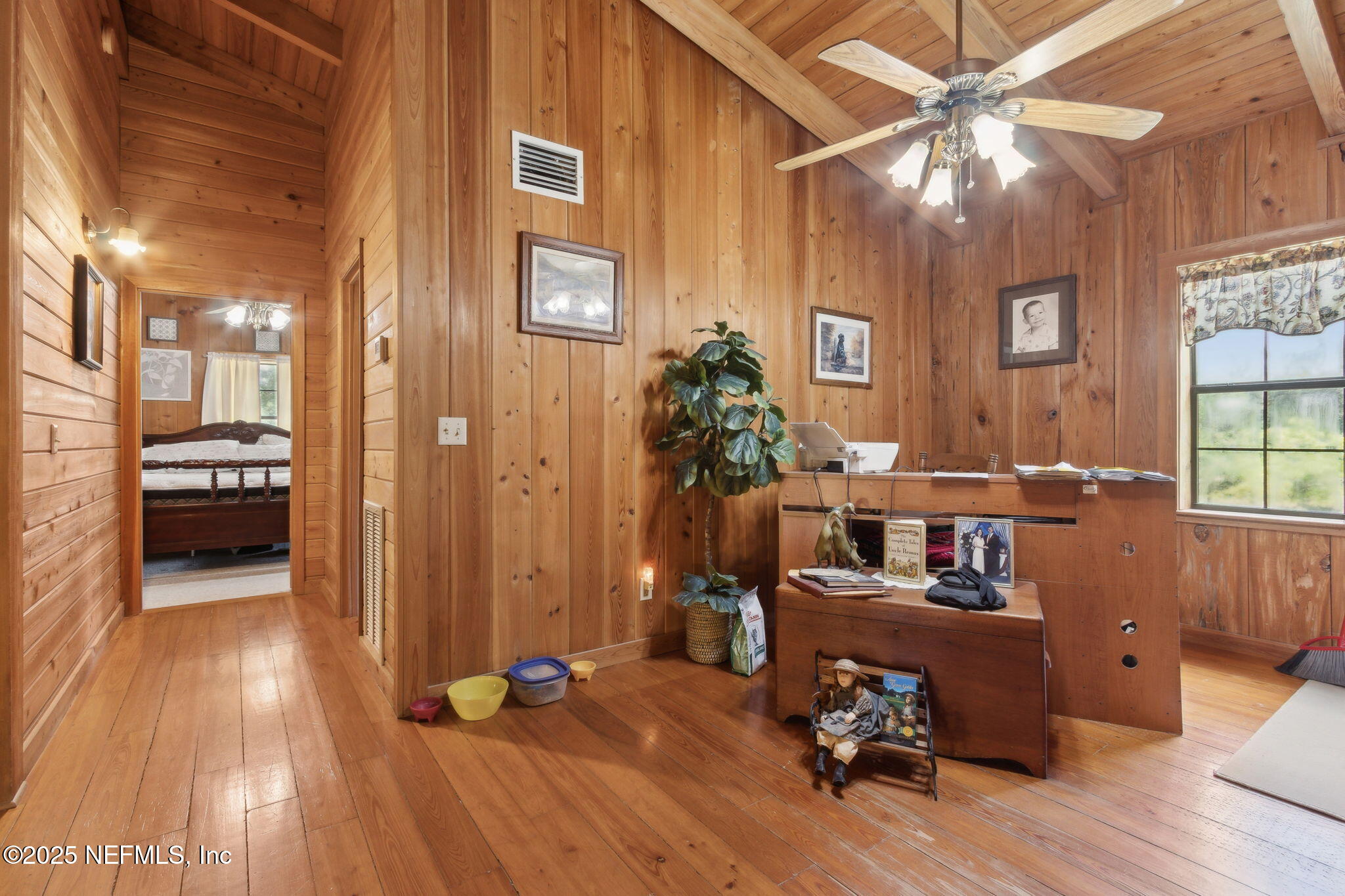 37334 Alice Street Hilliard, FL 32046 - Photo 25 of 80 a view of a livingroom with hardwood floor and a ceiling fan