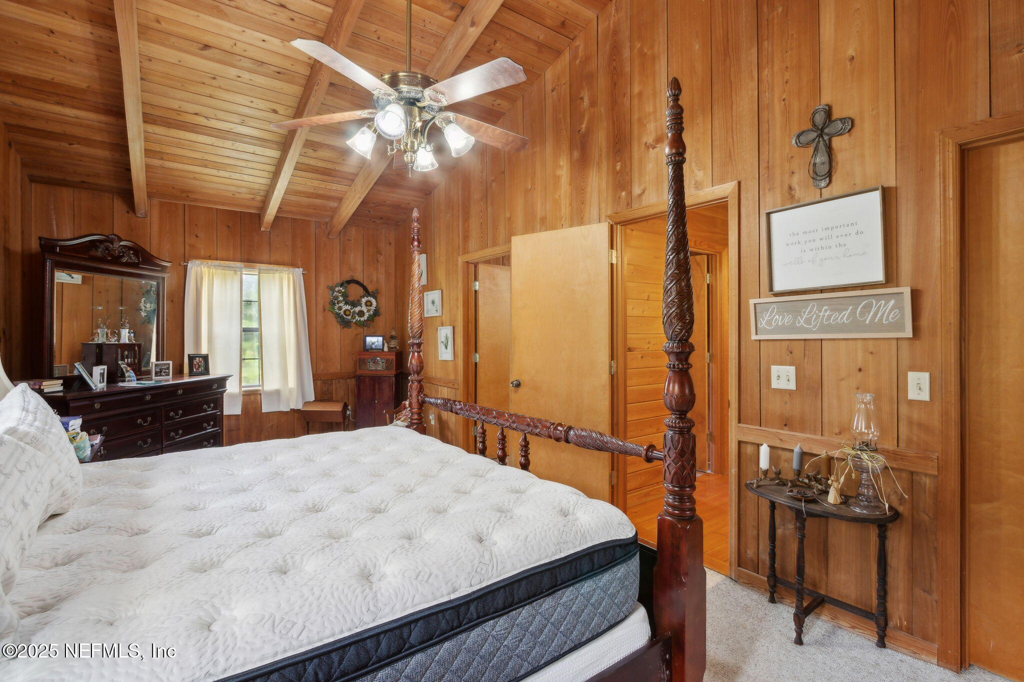 37334 Alice Street Hilliard, FL 32046 - Photo 28 of 80 a bed room with a bed and a large mirror