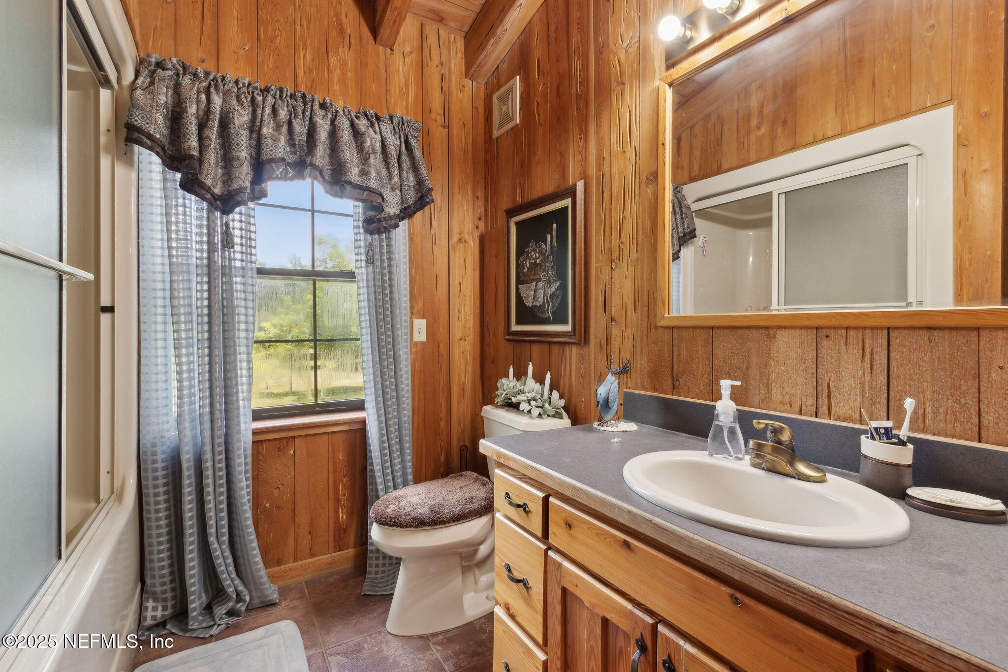37334 Alice Street Hilliard, FL 32046 - Photo 33 of 80 a bathroom with a granite countertop sink toilet and shower