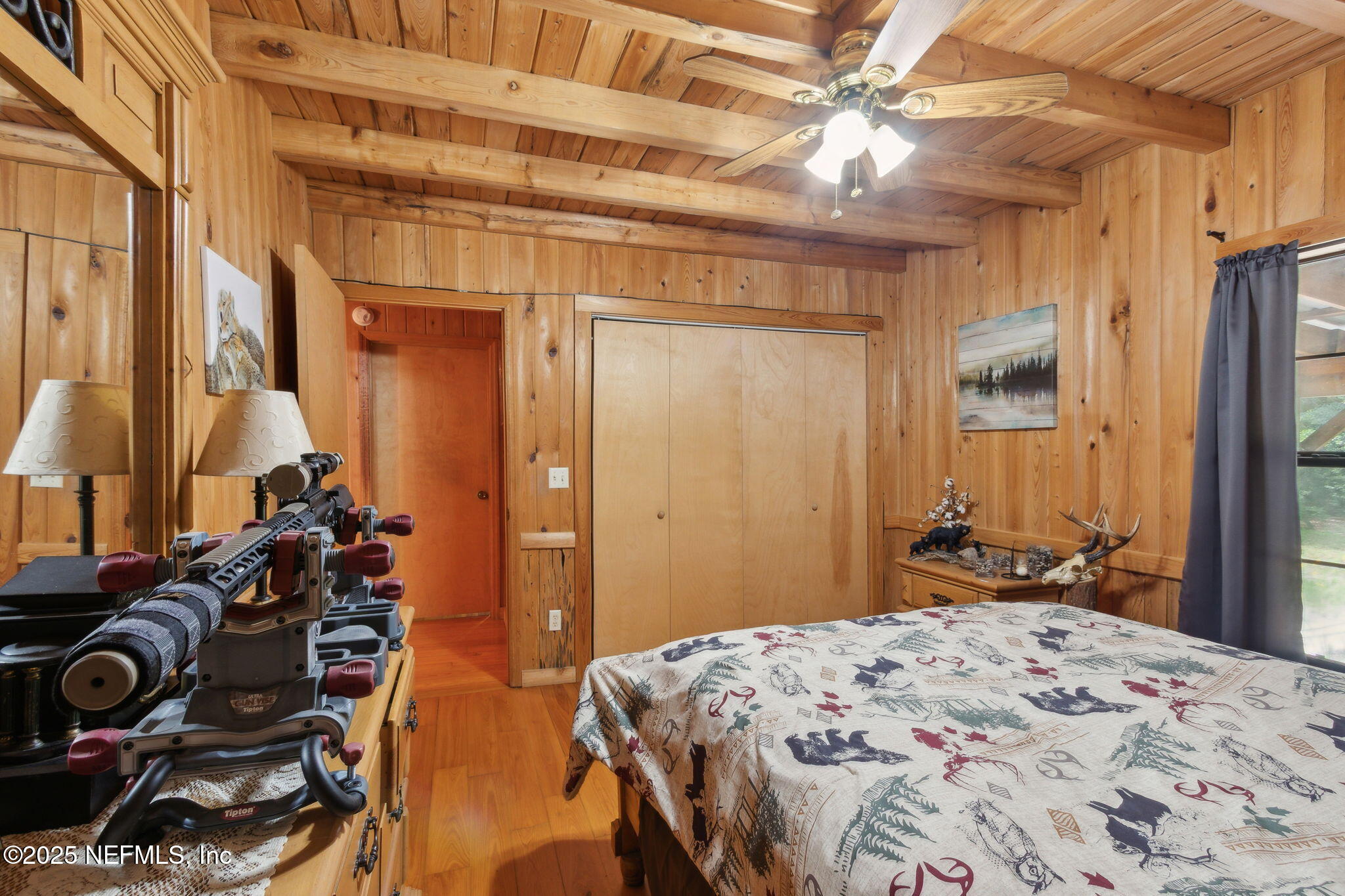 37334 Alice Street Hilliard, FL 32046 - Photo 35 of 80 a bedroom with a bed and a chandelier