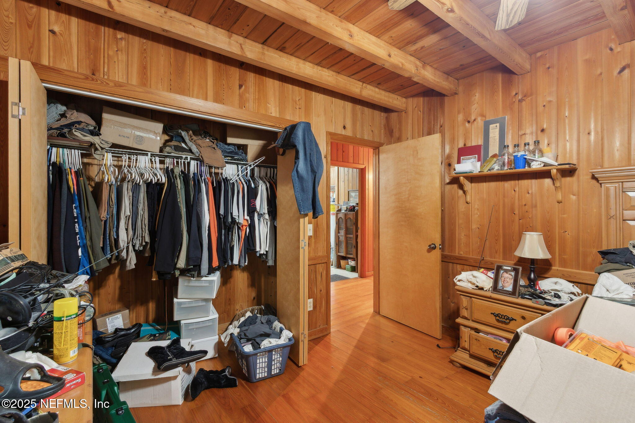 37334 Alice Street Hilliard, FL 32046 - Photo 37 of 80 a view of walk in closet with clothes and shoes