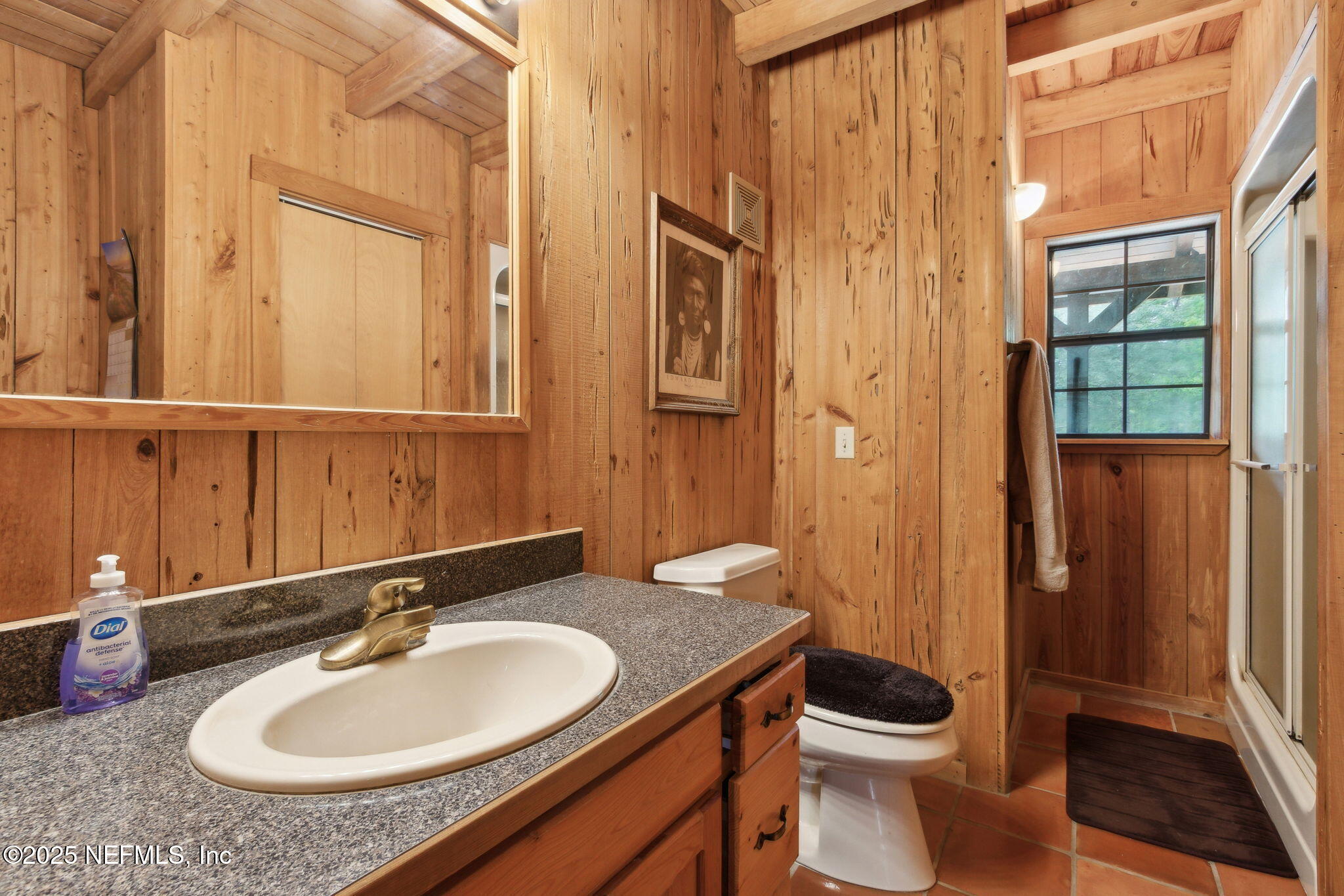 37334 Alice Street Hilliard, FL 32046 - Photo 38 of 80 a bathroom with a granite countertop sink toilet and shower