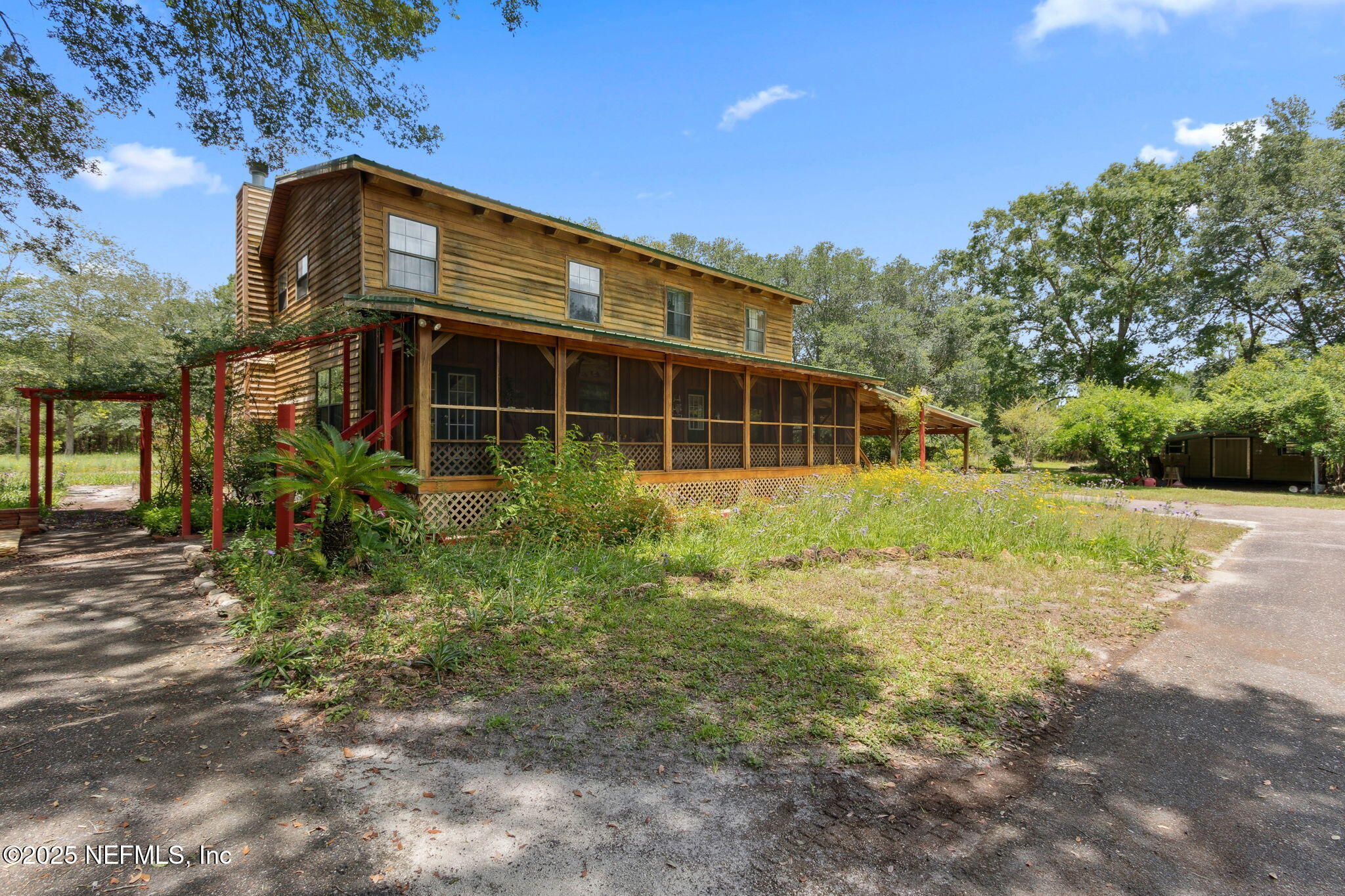 37334 Alice Street Hilliard, FL 32046 - Photo 47 of 80 a view of a house with backyard and garden