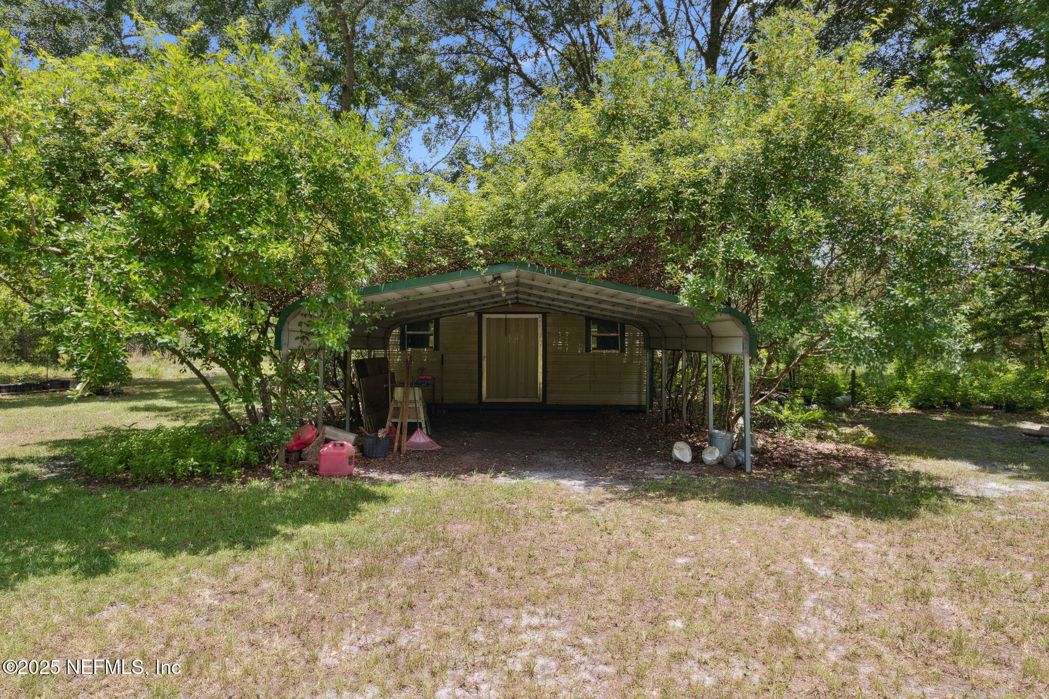 37334 Alice Street Hilliard, FL 32046 - Photo 50 of 80 a view of a house with a yard