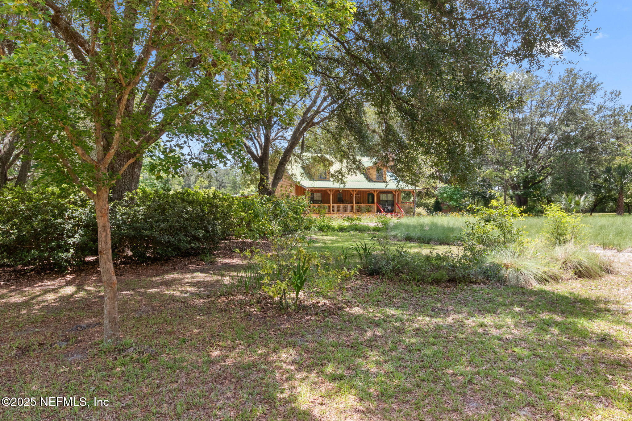 37334 Alice Street Hilliard, FL 32046 - Photo 5 of 80 a backyard of a house with lots of green space