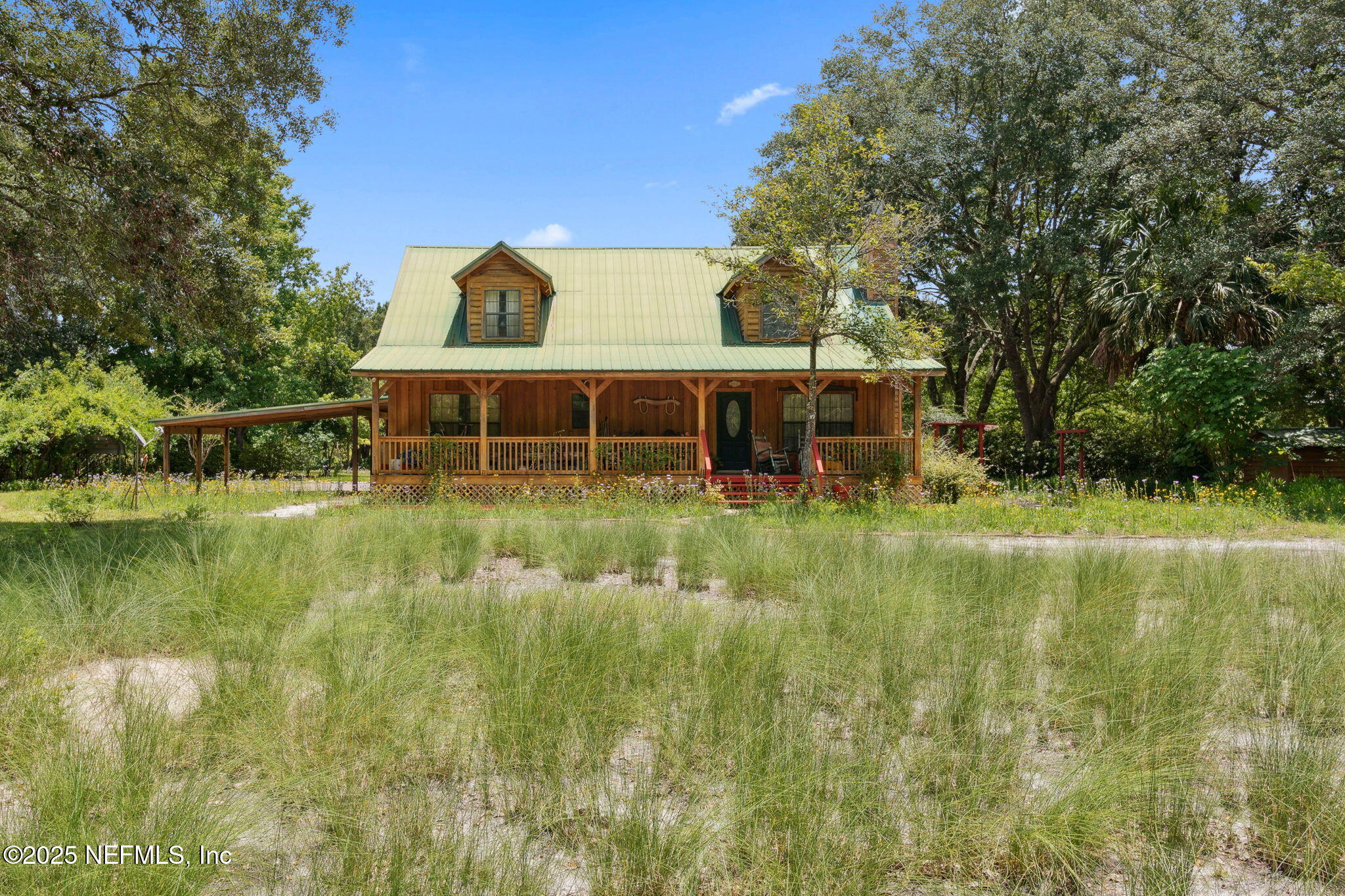 37334 Alice Street Hilliard, FL 32046 - Photo 6 of 80 a view of a house with a yard