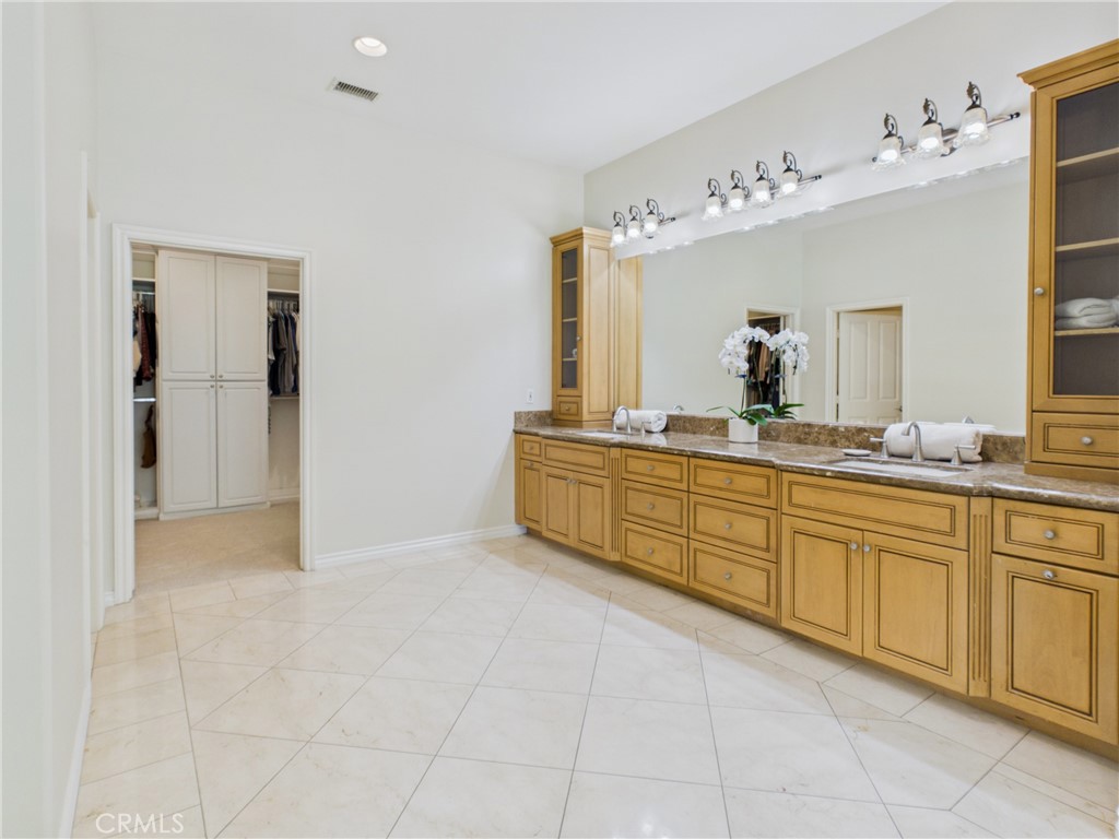 1662 Cherokee Road Corona, CA 92881 - Photo 35 of 60 Extended vanity with built-ins for linens, toiletries, or decor.