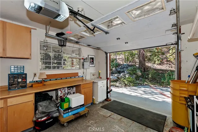 a living room with furniture a rug and a floor to ceiling window