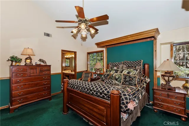 a bedroom with a bed and dresser