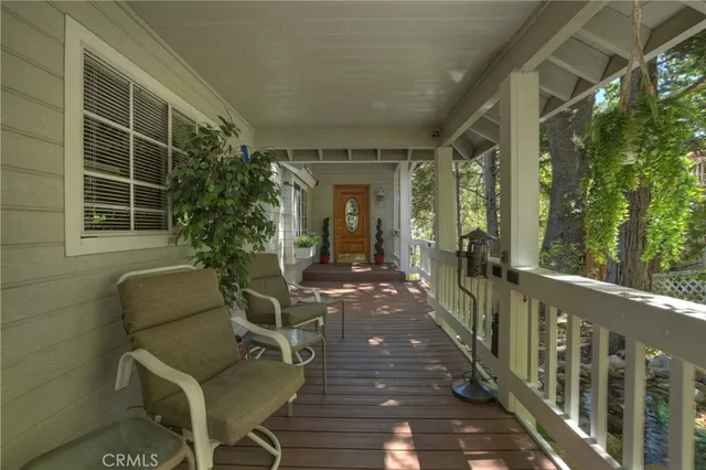 a view of a patio with couches chairs and potted plants