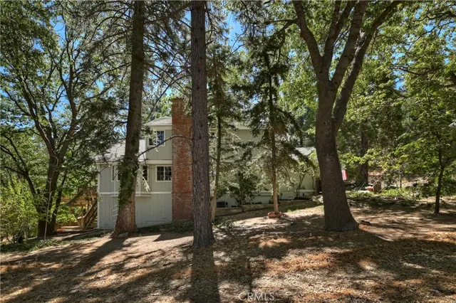 a backyard of a house with outdoor seating
