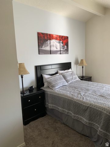 860 South Village Road, Unit B11 St. George, UT 84770 - Photo 7 of 19 Bedroom featuring carpet and vaulted ceiling