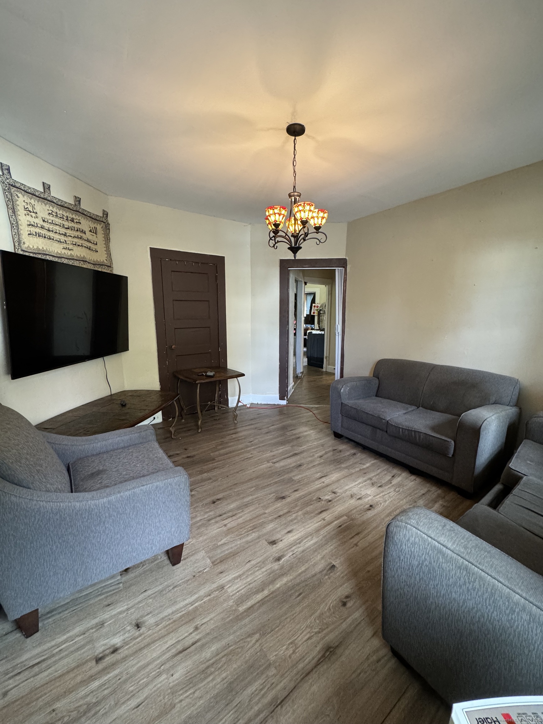 785 Connecticut Avenue, Unit 2 Bridgeport, CT 06607 - Photo 4 of 9 a living room with furniture and a flat screen tv