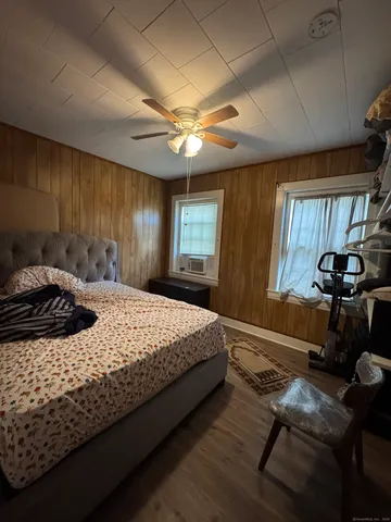 a bedroom with a bed and window