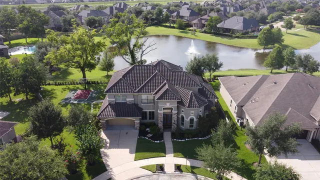 an aerial view of house with a lake view