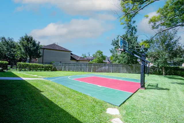 a view of a backyard with swimming pool