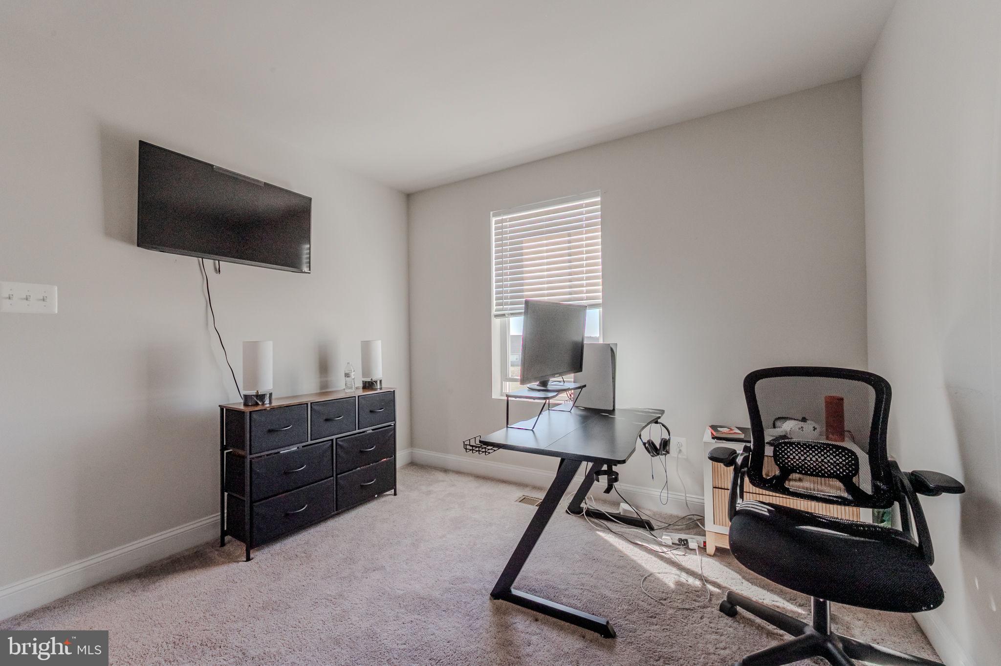 35262 Wright Way Millsboro, DE 19966 - Photo 23 of 42 a living room with furniture and a flat screen tv