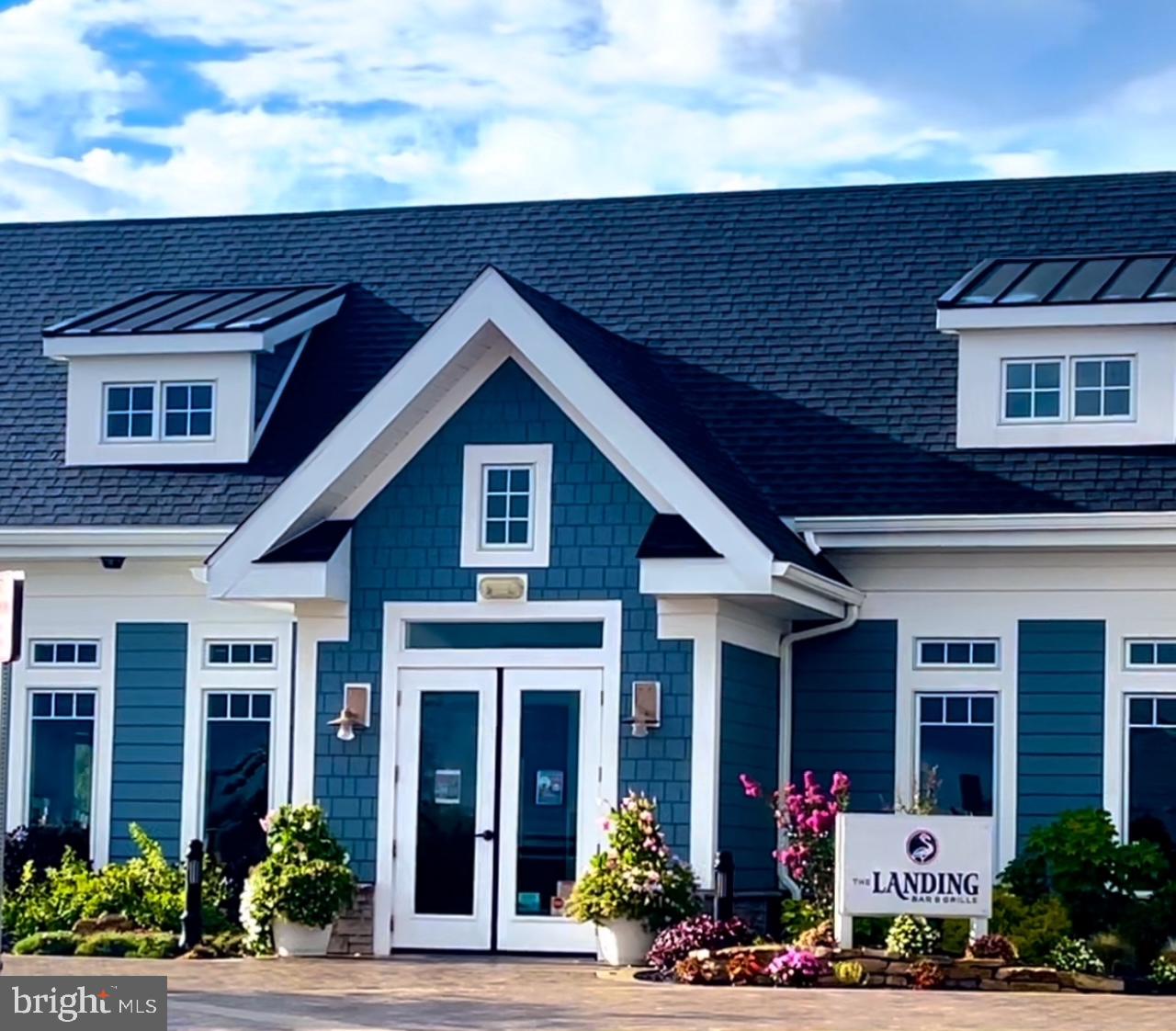 35262 Wright Way Millsboro, DE 19966 - Photo 27 of 42 a front view of a house with an outdoor space