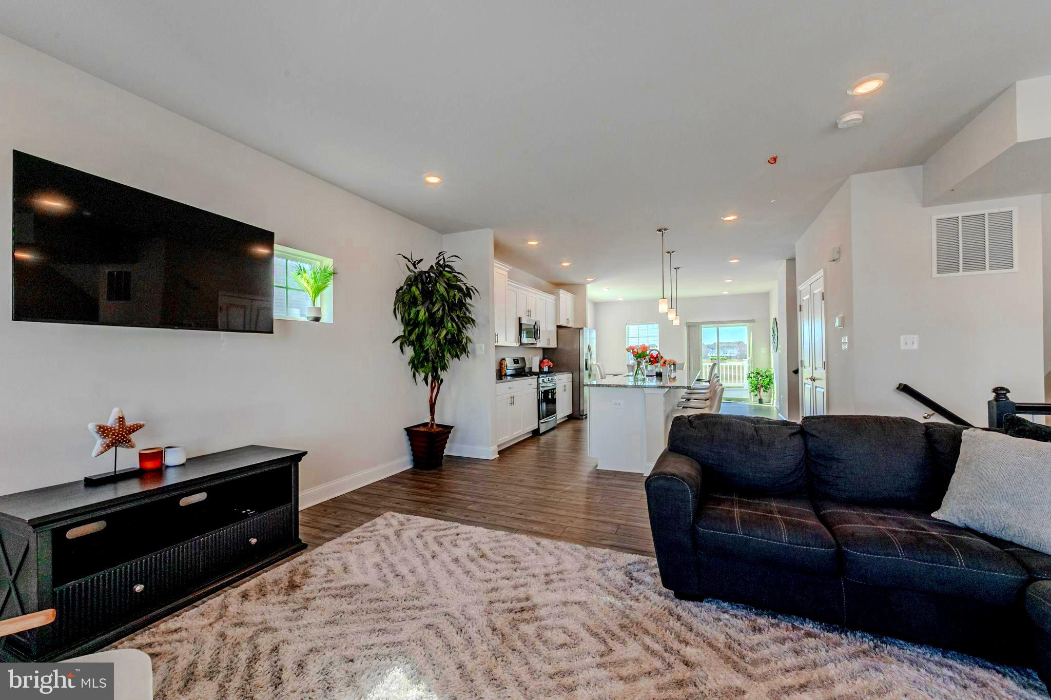 35262 Wright Way Millsboro, DE 19966 - Photo 3 of 42 a living room with furniture and a flat screen tv