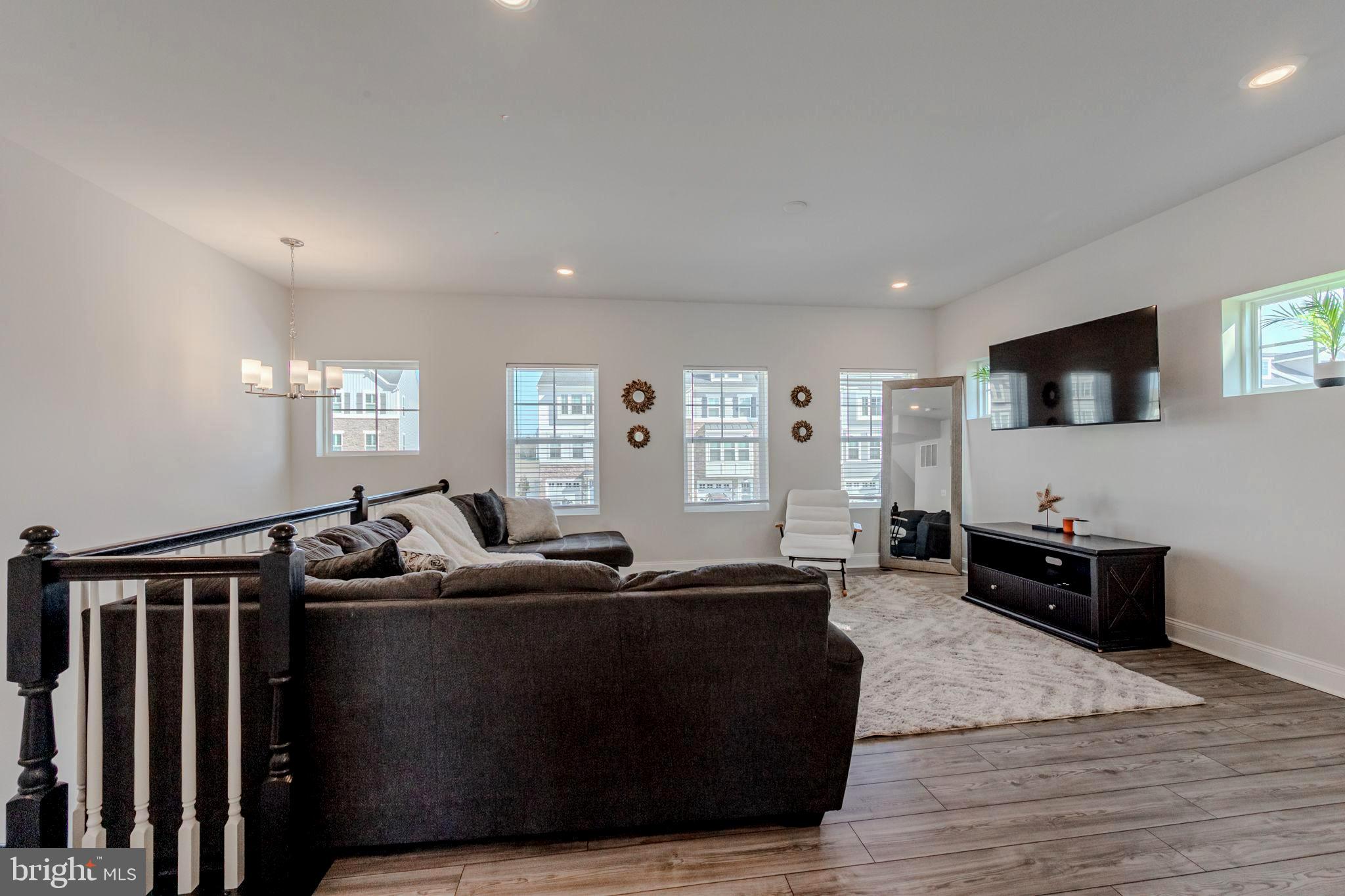 35262 Wright Way Millsboro, DE 19966 - Photo 4 of 42 a living room with furniture and a flat screen tv