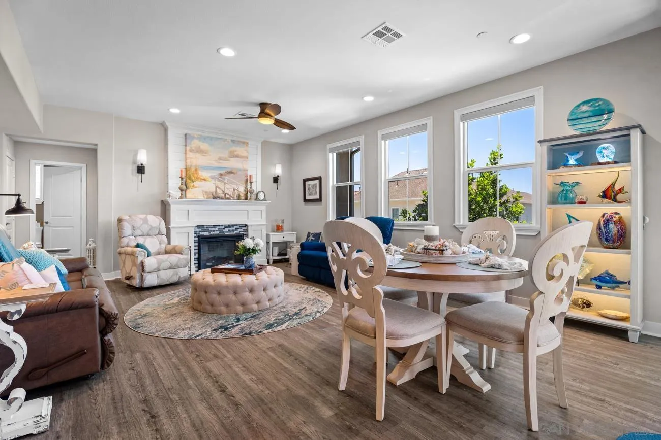 4326 Star Path Way, Unit 1 Oceanside, CA 92056 - Photo 10 of 46 a view of a livingroom with furniture a fireplace and wooden floor