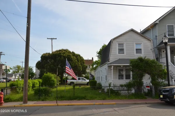 a view of house and a yard
