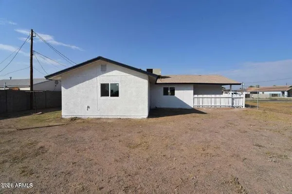 a white bath tub sitting next to a yard