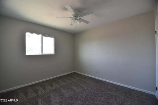 a bathroom with a granite countertop toilet a sink and bathtub