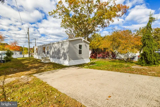 a view of a house with basketball court