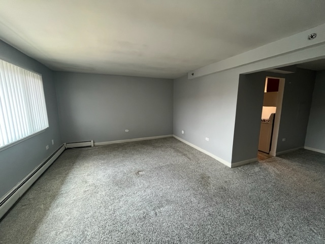 1919 South Wolf Road, Unit 416 Hillside, IL 60162 - Photo 3 of 24 an empty room with windows